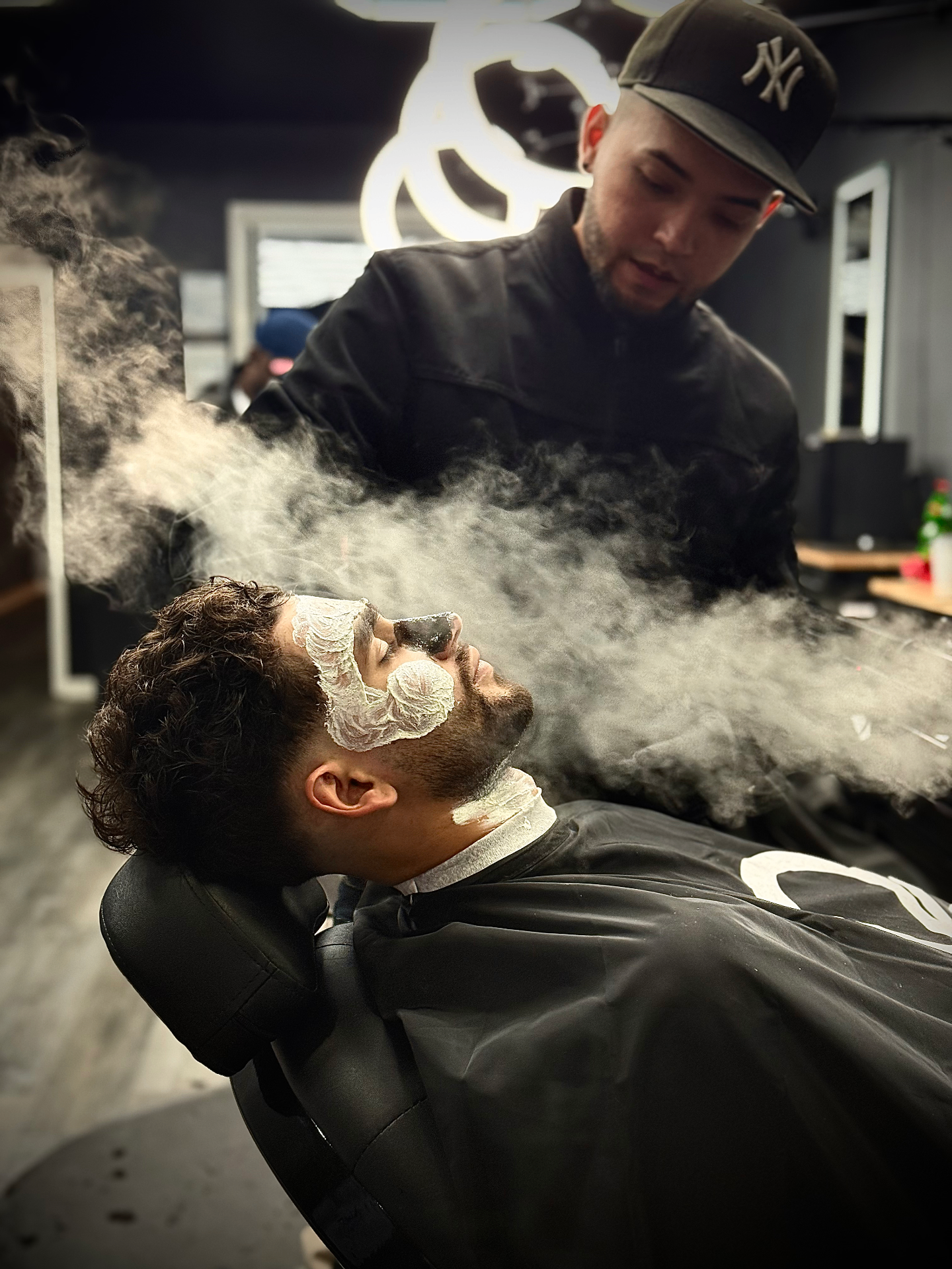 Barber at work with steam